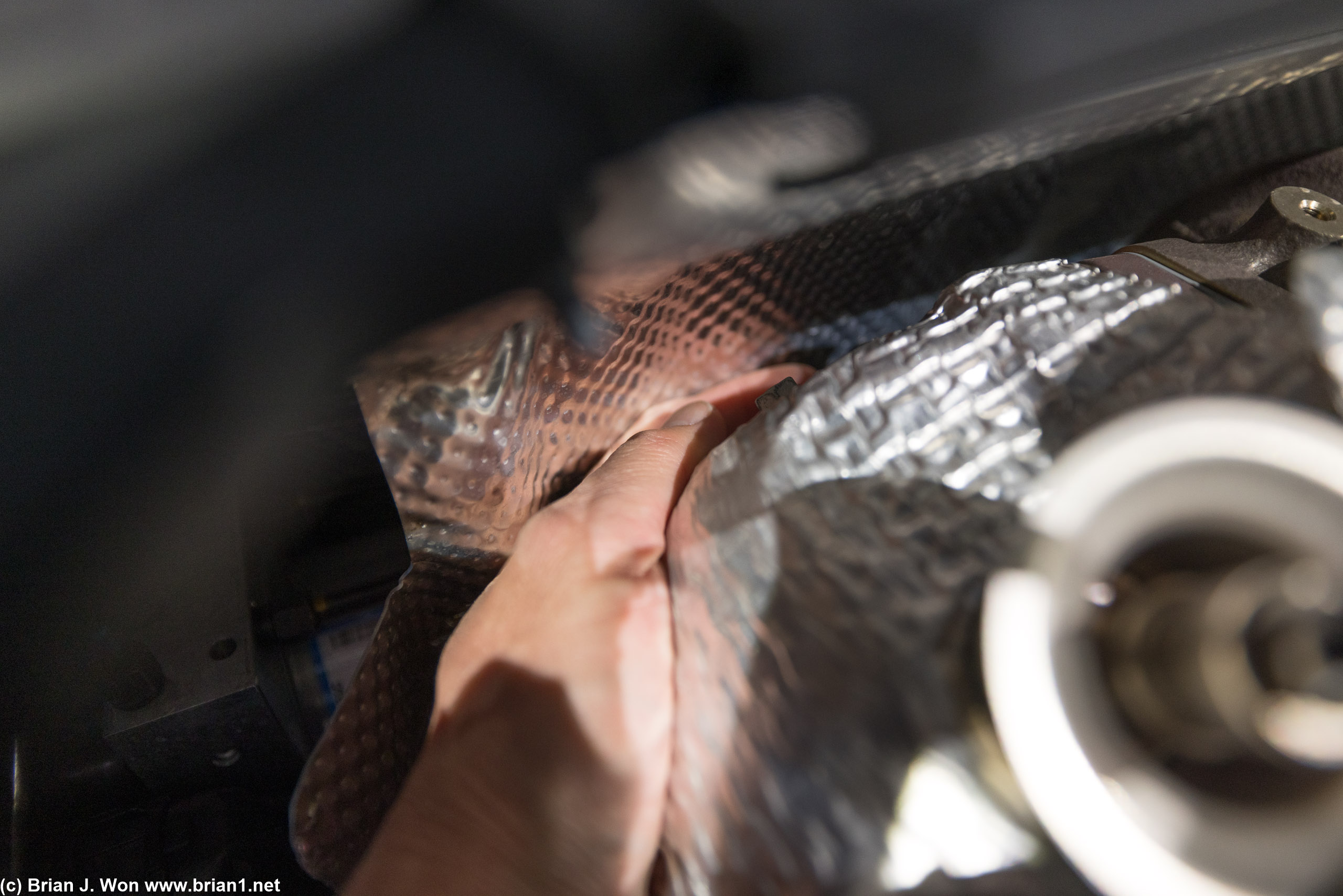 Could get a finger between the firewall and the turbo, but not much else.