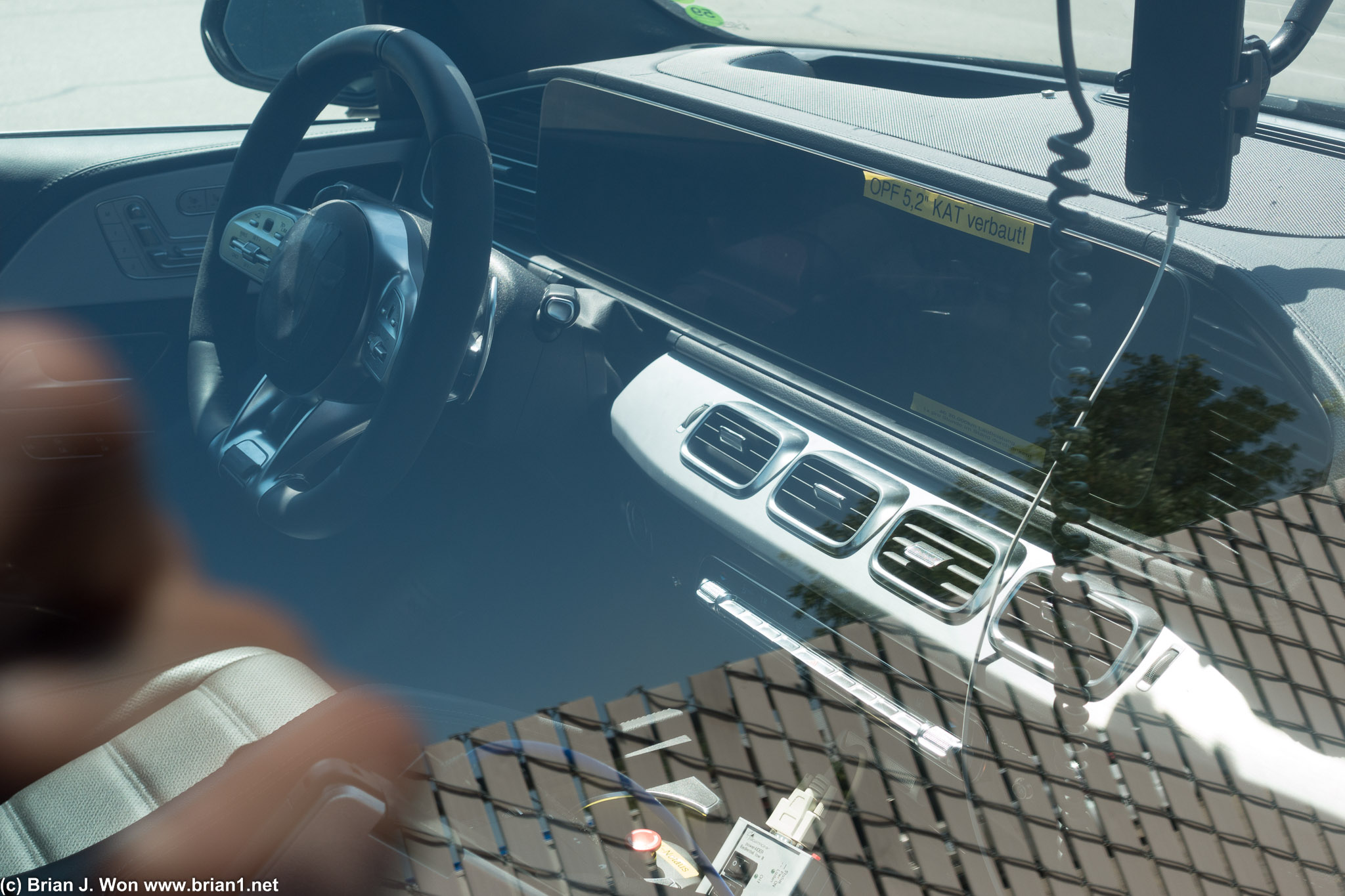 Quad vents and long horizontal screen clearly define it as the upcoming GLE.